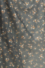 maternity wear in a gray floral print fabric with small orange and white flowers