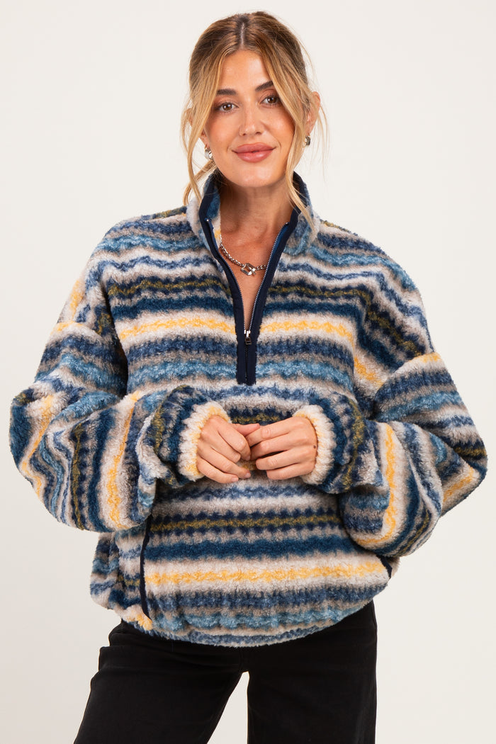 woman wearing a multicolored striped fleece maternity pullover with a half zipper and cozy fit