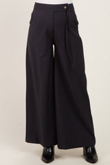 maternity wear black wide-leg pants with a tied waistband and front button detail