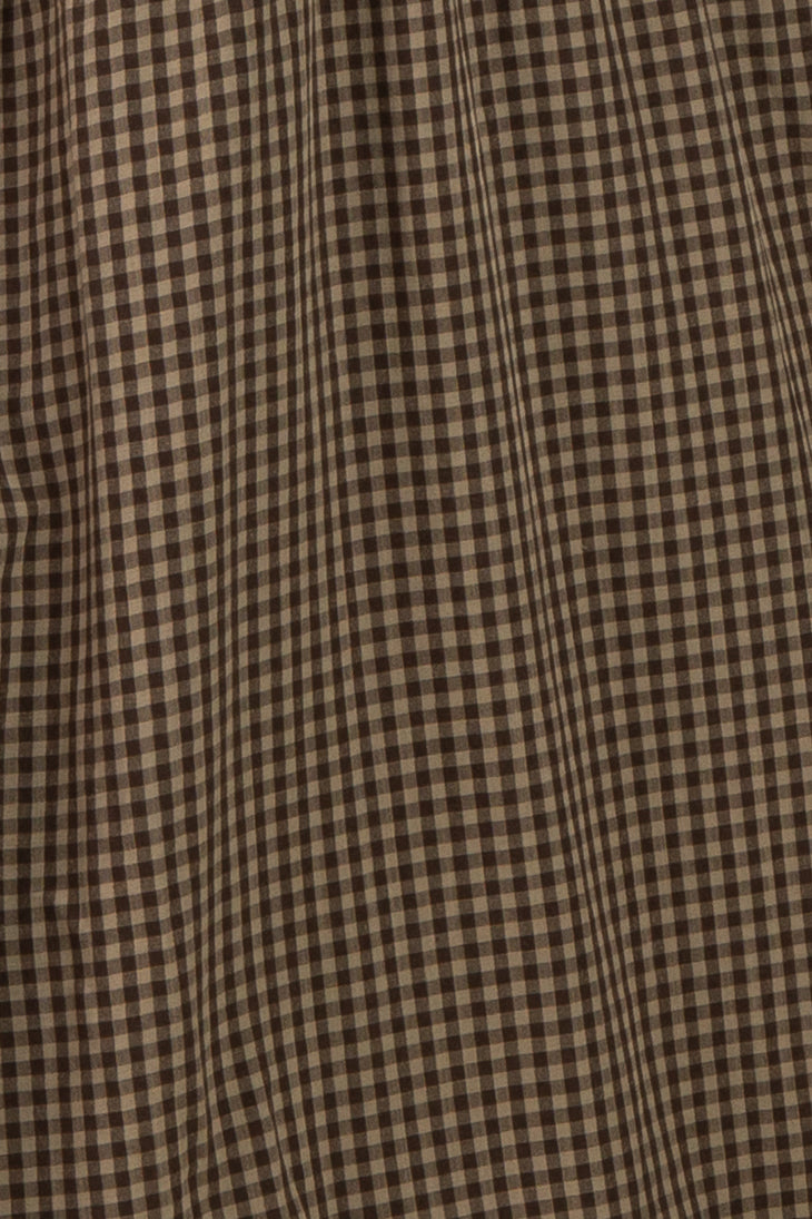 brown and beige gingham plaid fabric with a textured surface
