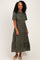 woman wearing a dark green floral print short sleeve midi dress with a tiered skirt and a collared neckline