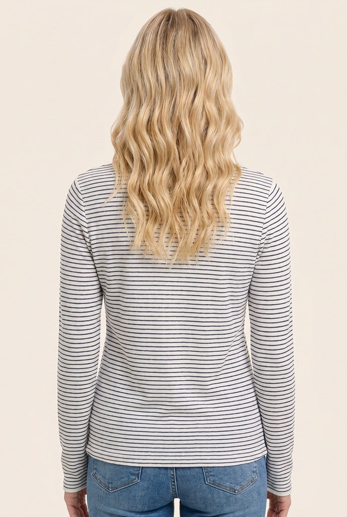 woman wearing a gray and white striped long sleeve top, viewed from the back