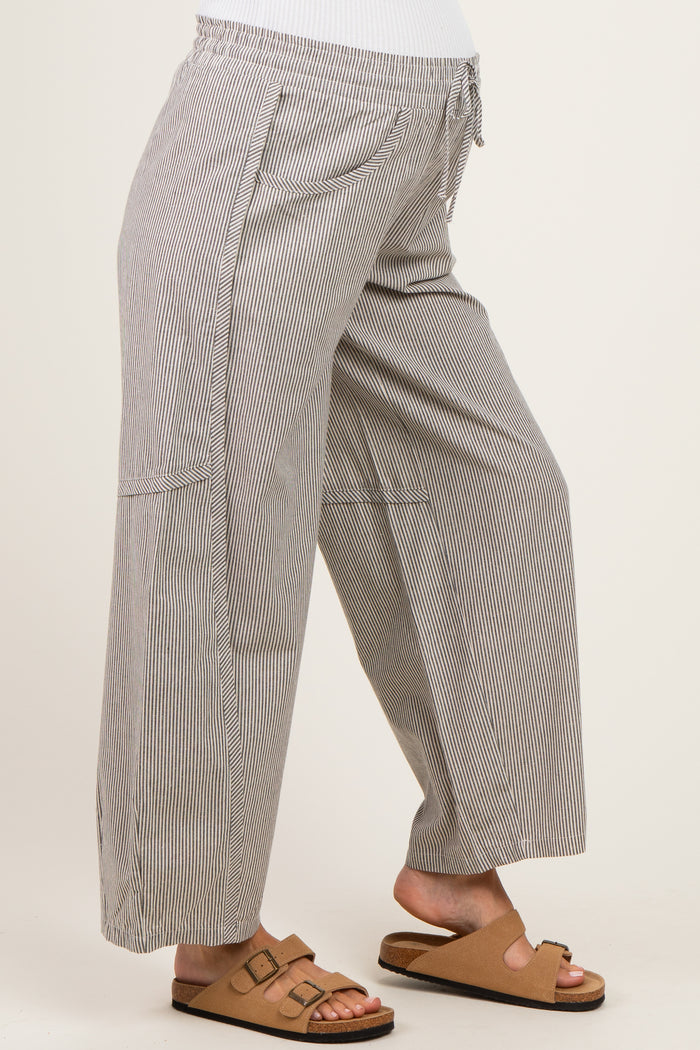 woman wearing maternity wide-leg striped pants with an elastic waistband and pockets