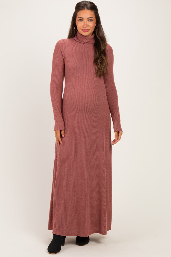 woman wearing a mauve long sleeve ribbed maternity maxi dress and showing her baby bump