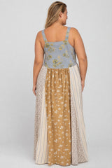 woman wearing a floral patterned maternity maxi dress with a blue top and multicolor skirt, showing her back