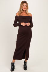 woman wearing a brown off-shoulder ribbed maternity dress with button details and a visible baby bump