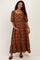 woman wearing a brown plaid maternity maxi dress with puff sleeves and a ruffled hem, holding her baby bump