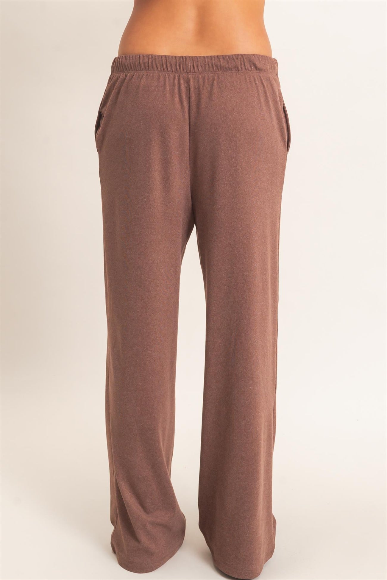 woman wearing brown wide-leg lounge pants with side pockets