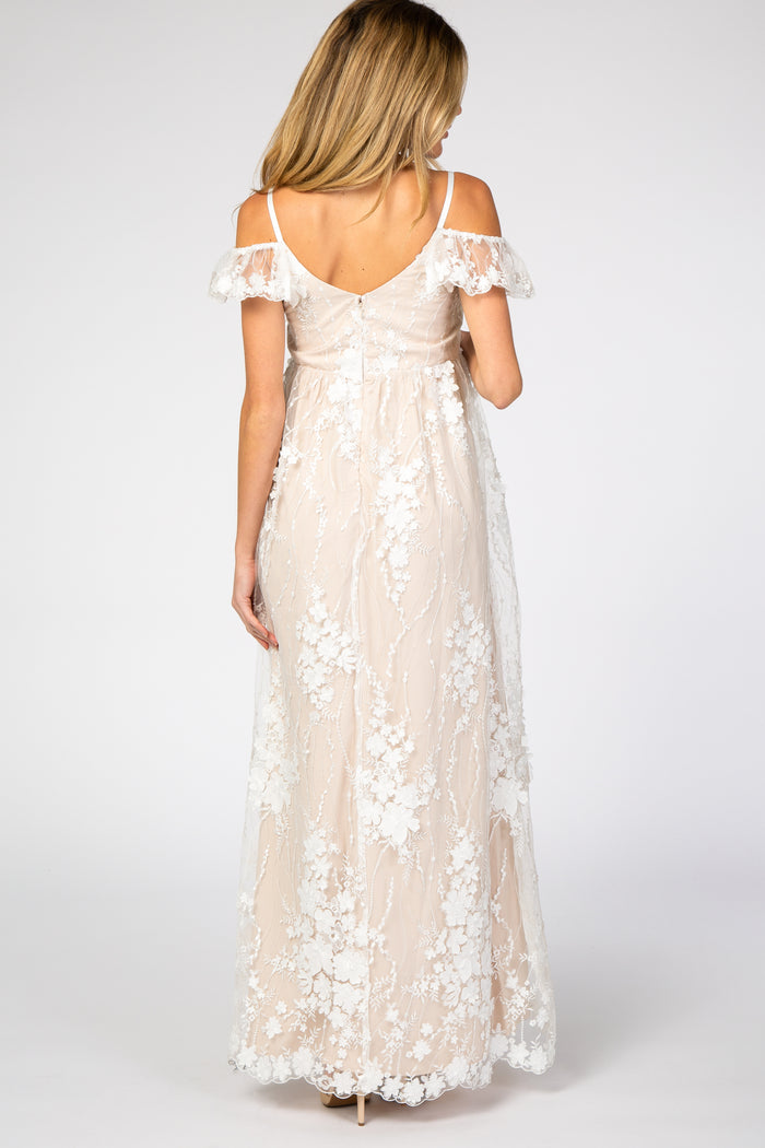 back view of woman wearing cream floral lace maternity maxi dress with cold shoulder sleeves