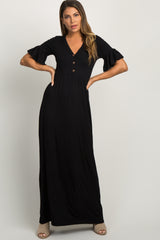 woman wearing a black short sleeve button front maternity maxi dress with ruffle sleeves