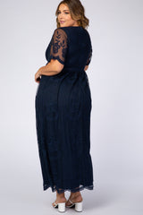woman wearing a navy blue lace plus-size maxi dress with short sleeves and a fitted waist, viewed from the back