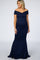 woman wearing a navy off-the-shoulder maternity gown with a fitted silhouette and a flared hem showcasing her baby bump