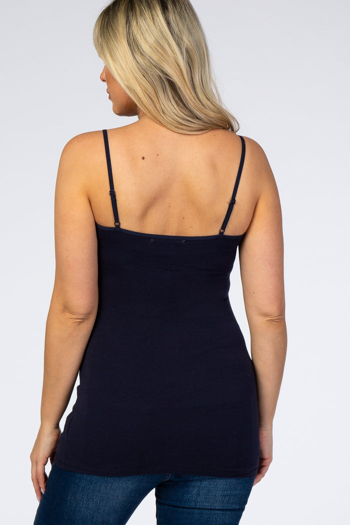woman wearing a navy blue maternity camisole top with adjustable straps and a fitted silhouette