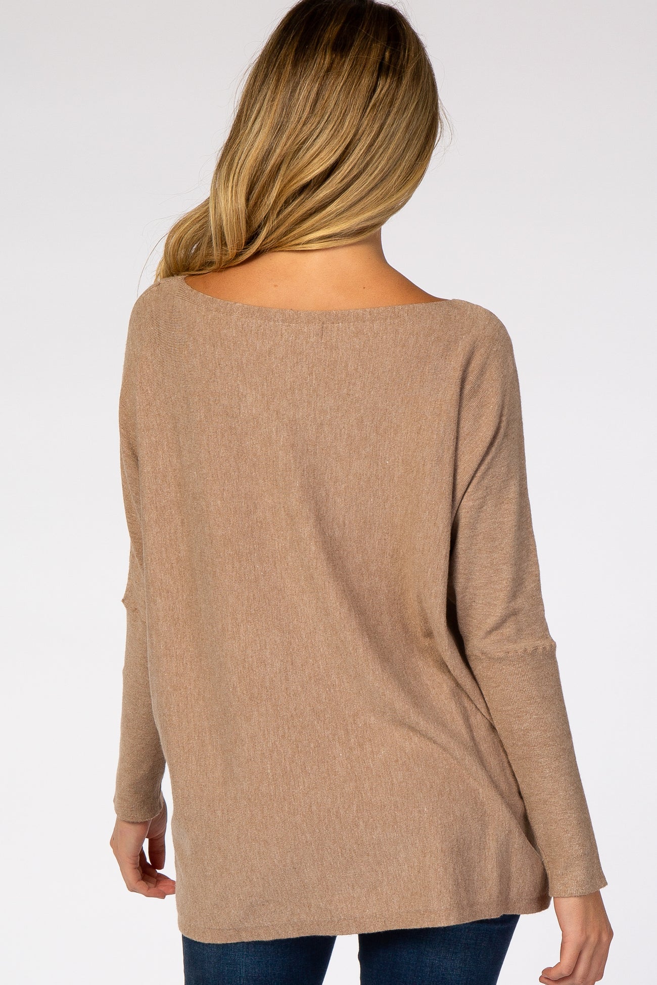 woman wearing a relaxed fit taupe maternity sweater viewed from the back with long sleeves and a wide neckline