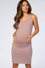 woman wearing a light mauve tank dress, showcasing her baby bump, designed for maternity wear