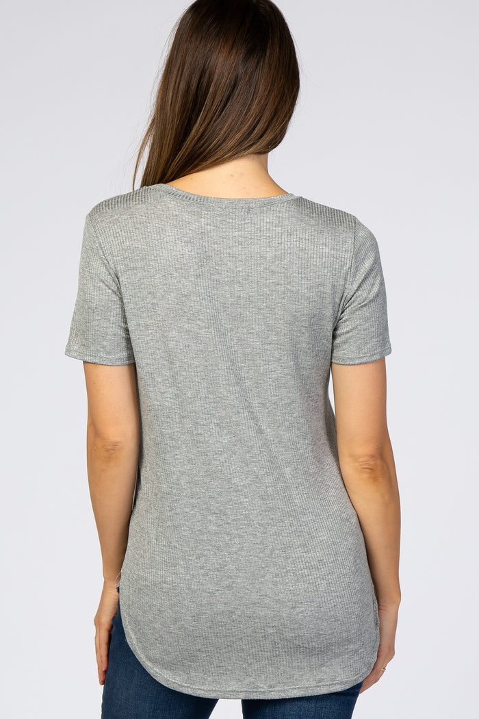woman wearing a light grey short sleeve maternity top with a rounded hemline, showing a smooth back view