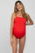 woman wearing a red maternity swimsuit with adjustable straps and a visible baby bump