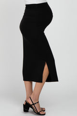 woman wearing a black maternity midi skirt with a side slit and a visible baby bump
