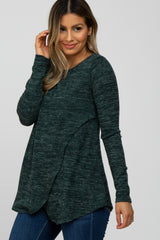 woman wearing a long sleeve forest green marled maternity nursing top with crossover detail