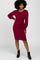 woman wearing a maroon long sleeve knit dress with a tie waist detail and black ankle boots