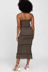 woman wearing a brown floral print tiered midi dress with spaghetti straps and ruffled hem