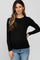 woman wearing a black long sleeve maternity top and showing her baby bump