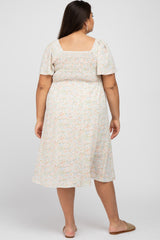 woman wearing a floral print plus-size midi dress with short sleeves and a smocked bodice, viewed from the back