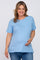 woman wearing a light blue short sleeve maternity top and holding her baby bump