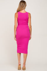 woman wearing a hot pink ribbed maternity midi dress, seen from the back