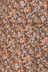 brown floral dress with a tiered design featuring pink and purple flowers
