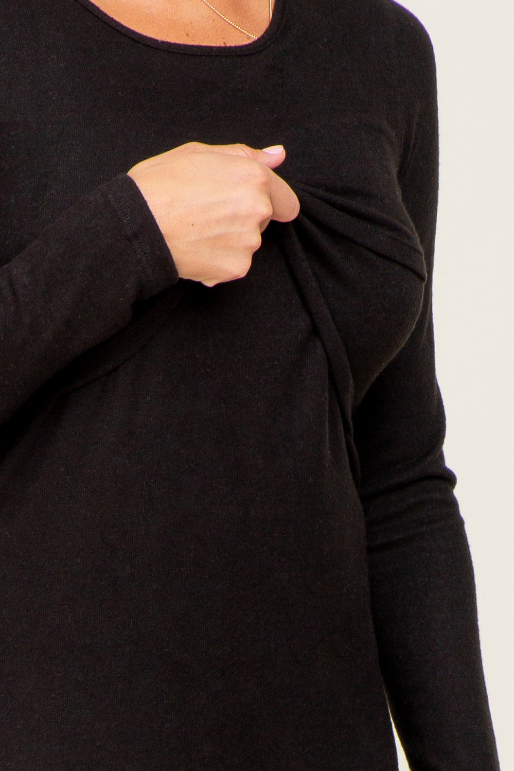 black long sleeve top with a gathered front detail and nursing access