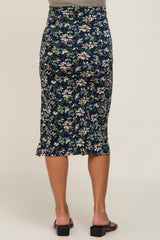 woman wearing a navy floral maternity pencil skirt, showing a fitted silhouette and knee-length style from the back