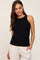 woman wearing a black ribbed maternity tank top with a fitted style and round neckline