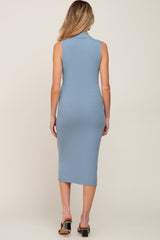 woman wearing a light blue sleeveless maternity dress with a ribbed texture, showing a fitted silhouette from the back