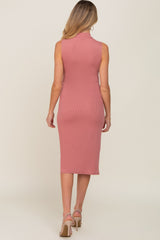 Back view of a woman wearing a mauve ribbed sleeveless midi dress with a mock neck and beige heels