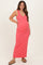 woman wearing a coral sleeveless maxi maternity dress with a visible baby bump and flat sandals