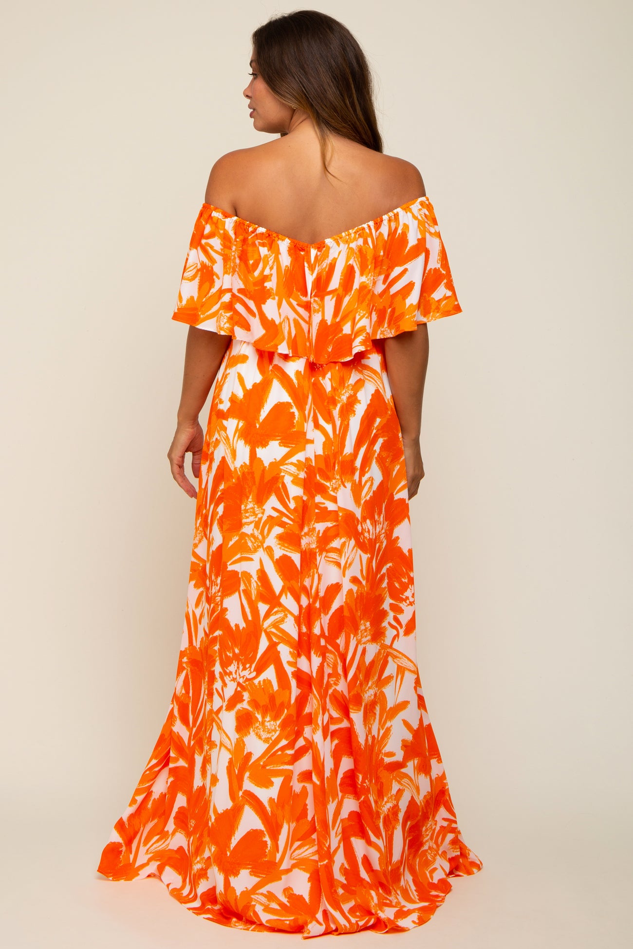 maternity wear off-the-shoulder maxi dress in orange and white floral print with a flowy skirt and ruffled sleeves