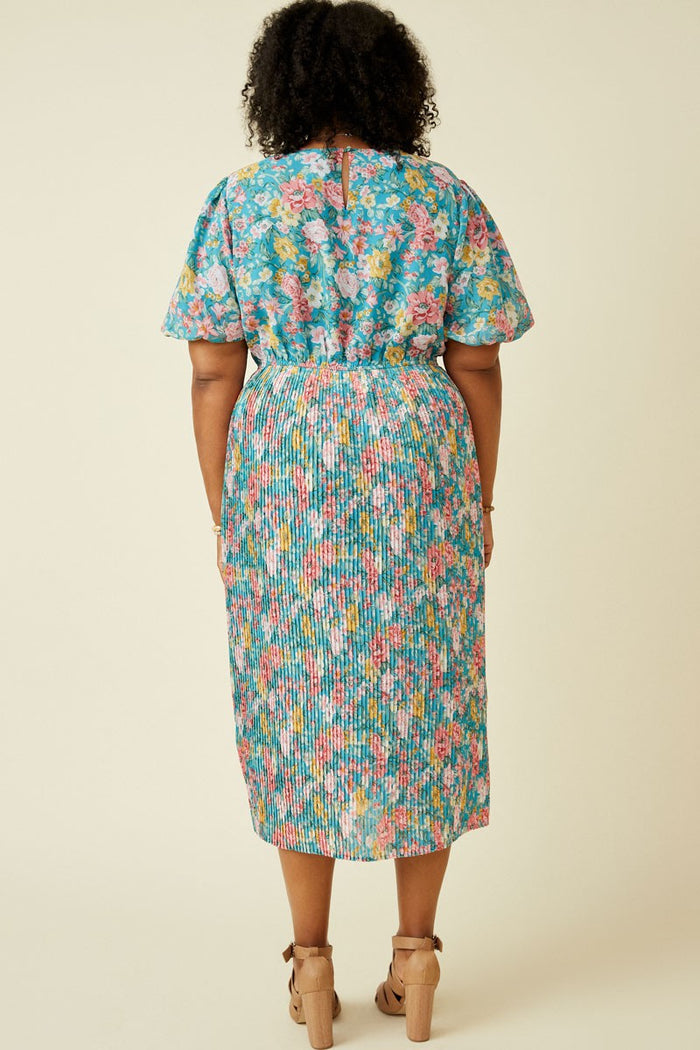 back view of a woman wearing a plus size floral print midi dress with a smocked waistband and short sleeves