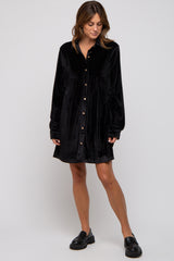 woman wearing a black velvet long sleeve shirt dress with buttons and relaxed fit