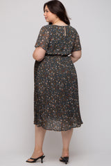 woman wearing a floral print maternity plus dress with a pleated skirt and short sleeves, viewed from the back
