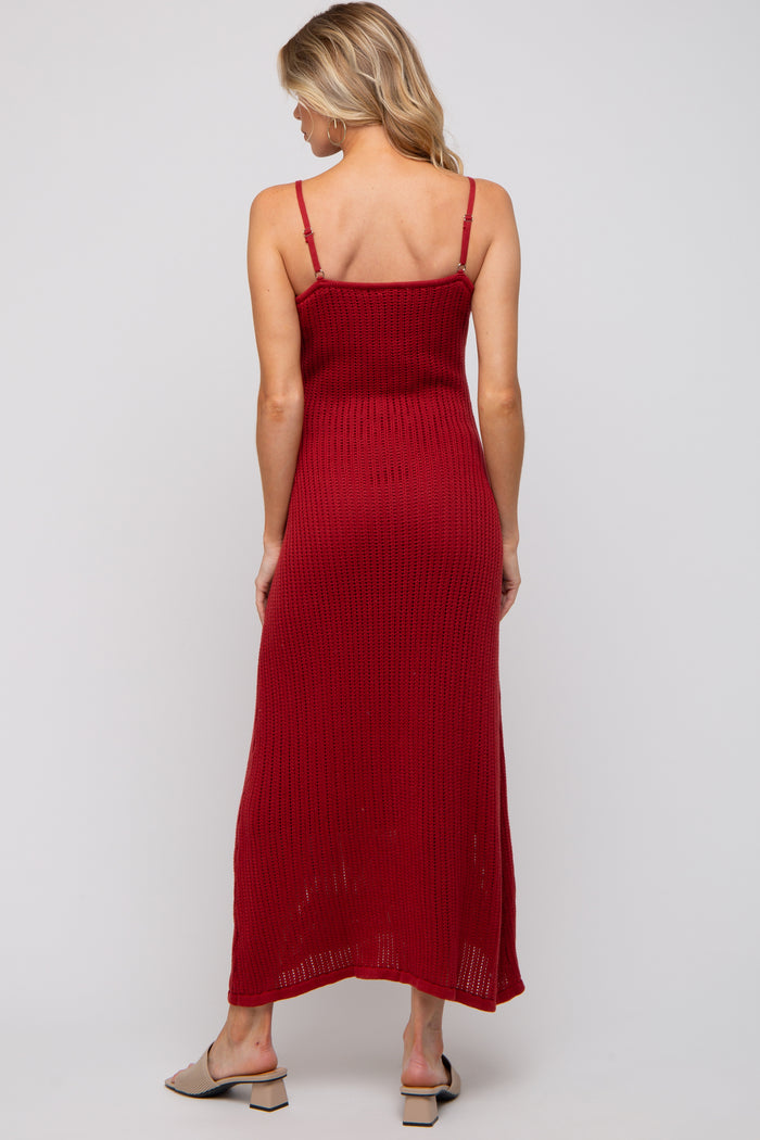 woman wearing a red knitted maternity maxi dress with adjustable straps, shown from the back