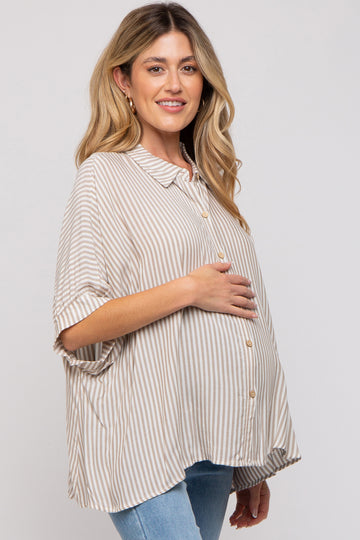 woman wearing a beige and white striped maternity shirt, holding her baby bump, styled with button details