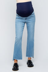maternity wear blue flared jeans with a navy belly panel and raw hem, model showing baby bump