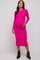 woman wearing a bright pink long sleeve maternity dress and holding her baby bump
