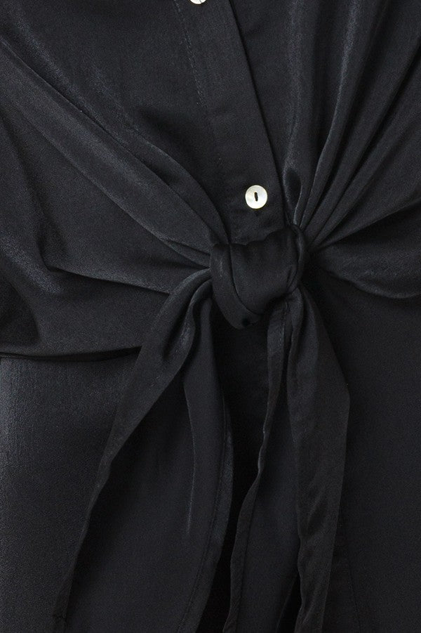 black short sleeve blouse with a tied front detail and button-down closure