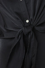 black short sleeve blouse with a tied front detail and button-down closure