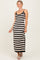 woman wearing a black and cream striped maxi dress with thin straps and a fitted silhouette