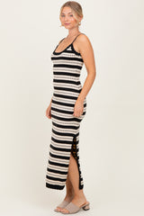 woman wearing a black and white striped maxi dress with side slit and lace trim details