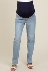 woman wearing light blue maternity jeans with a dark blue belly panel