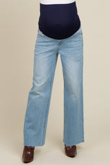 maternity wear light blue wide-leg jeans with a navy blue over-the-bump panel and a frayed hem
